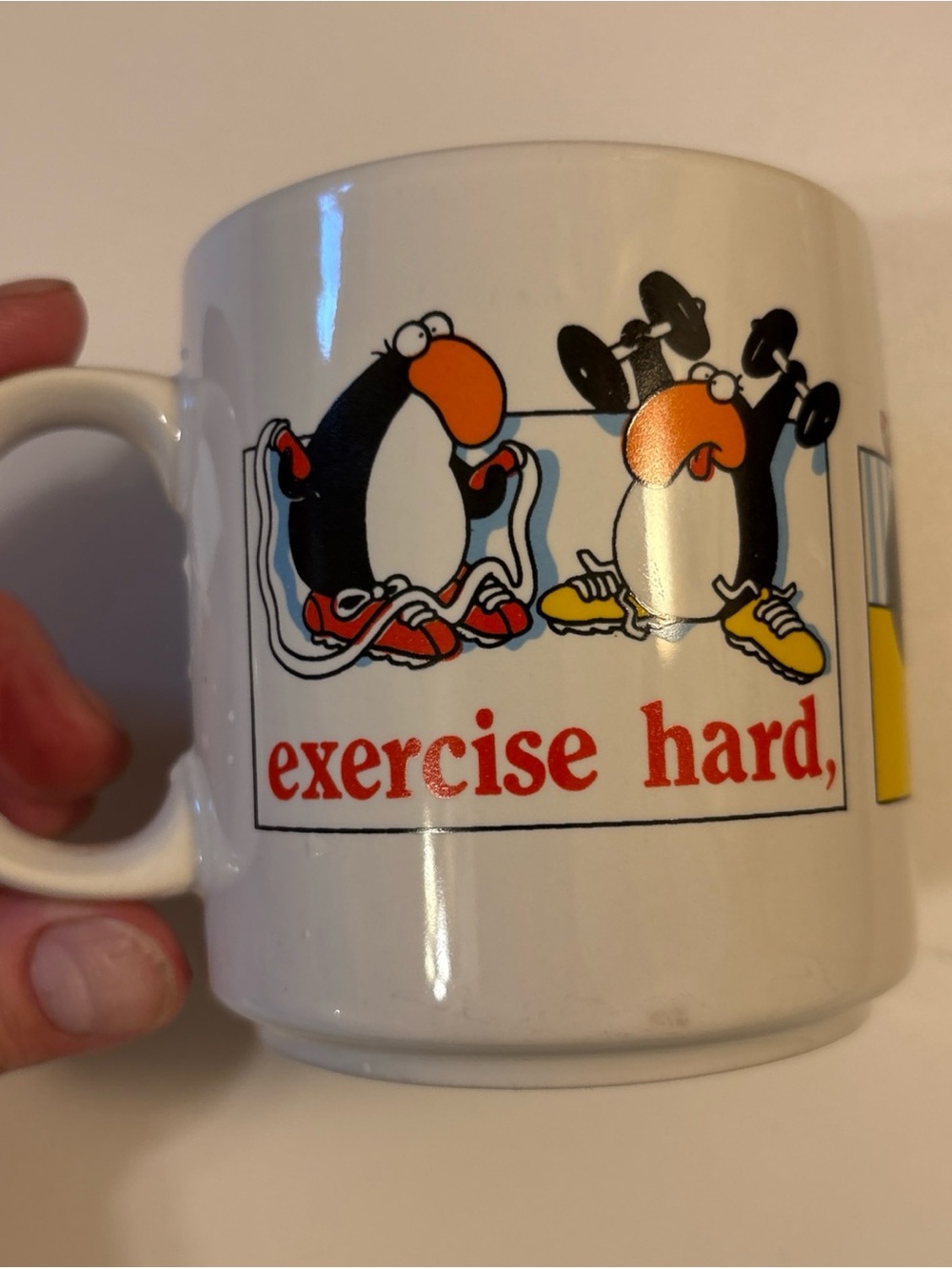 Russ White Ceramic Mug by Jim Benton with Penguin Exercise Cartoon and Red Text